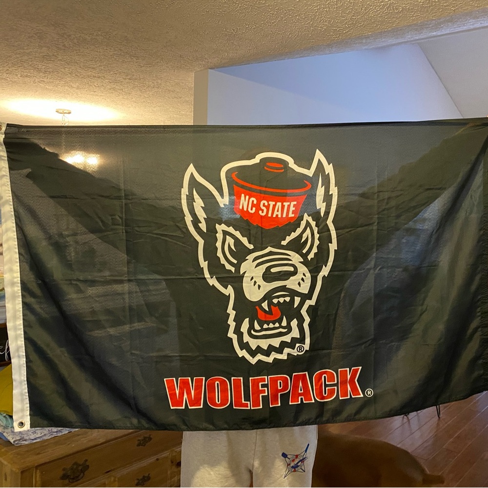 NC State Wolfpack flag 56” wide x 35” long, preowned, double stick tape residue